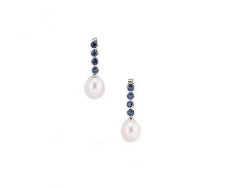 A pair of pearl and sapphire ear pendants, each with four rubover set round faceted sapphires, suspending an oval shaped cult