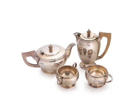 An Elizabeth II silver 4-piece tea set, mark not traced (C.E), London 1956/7, the teapot of simple circular form, part marked