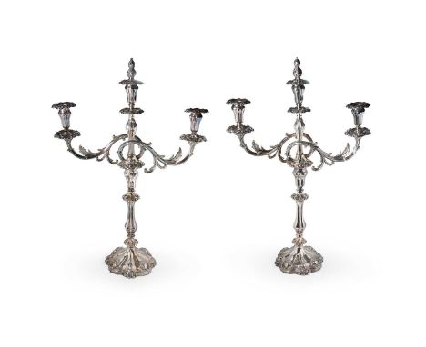 A pair of silver plated 3 light metamorphic candelabra, each with decorative scalloped and fluted filled base, pear shaped kn