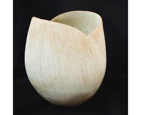 John Ward (b.1938) Stoneware tulip shaped vase with shaped rim and finished in a mottled cream and light blue finish with imp