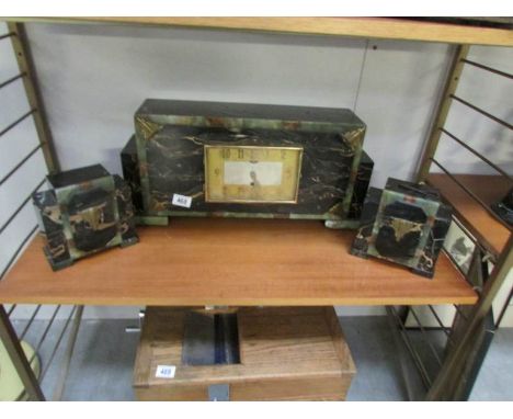 A 3 piece art deco style clock garniture (spring wound to limit, balance wheel looks ok)