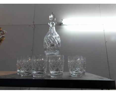 A cut glass decanter and 6 glasses