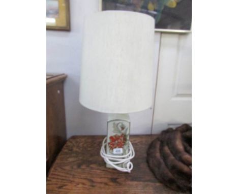 A pottery table lamp with shade