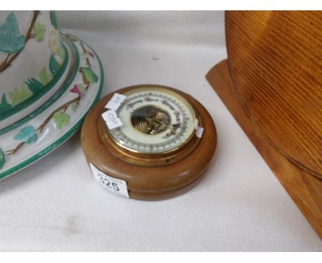 A small circular barometer