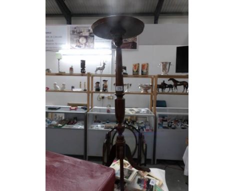 A tripod pot stand
