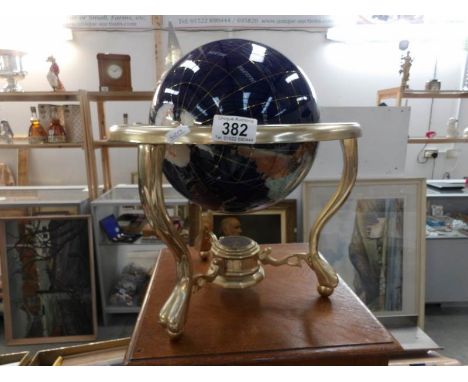 A gem stone table globe