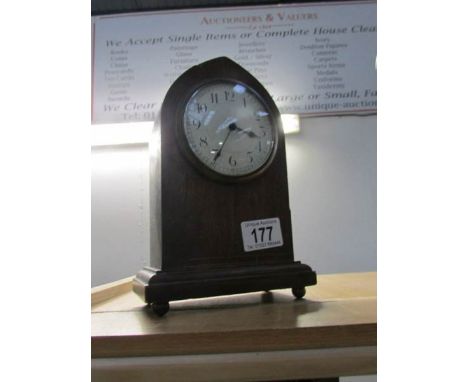 An Edwardian arched top mantel clock