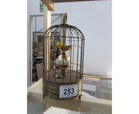A novelty bird in cage clock