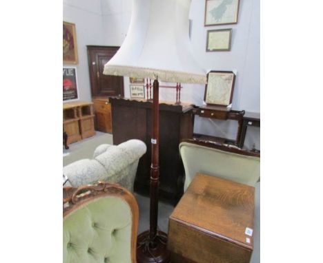 A standard lamp with shade