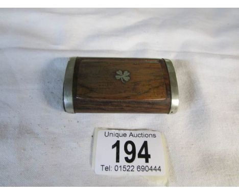 An old teak snuff box inlaid with metal