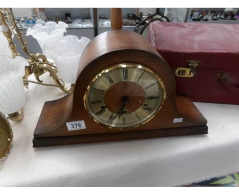 An oak mantel clock
