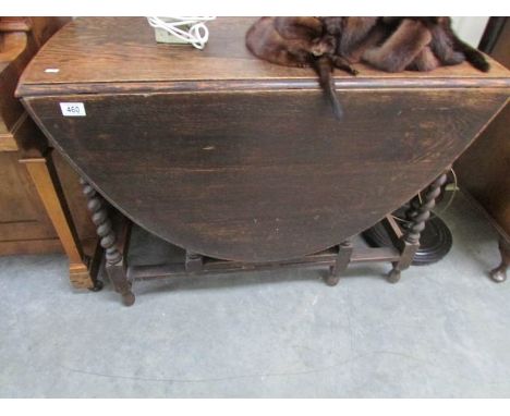 An oak barley twist gate leg table