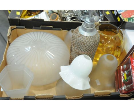 Box of light shades and vintage soda siphon 
