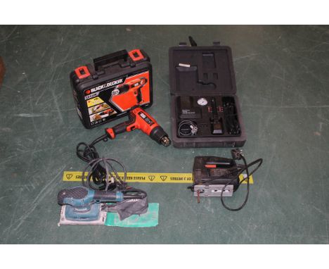 Box of Black &amp; Decker stripper, jigsaw, Makita sander and cased compressor by Busy Body