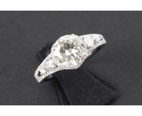 a 1,51 carat high quality brilliant cut diamond set in nicely made ring in white gold (18 carat) with 0,58 carat of very high