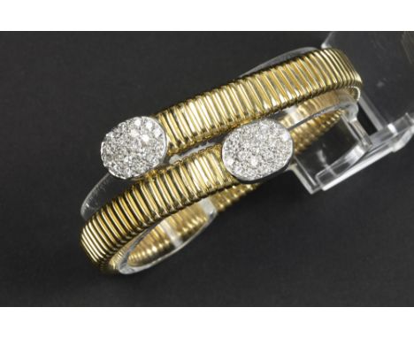 nineties' vintage bracelet with the corpus (with special stretch system) in yellow gold (18 carat) and with a double oval orn