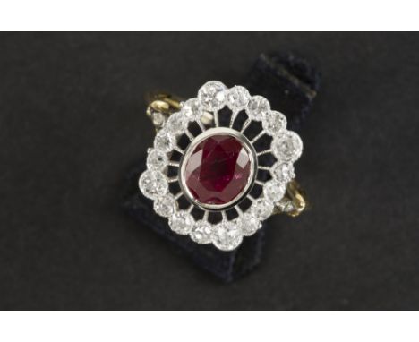 late Art Deco ring in yellow and grey gold (18 carat) with a ca 1,80 carat Siamese ruby surrounded by ca 0,85  carat of old b