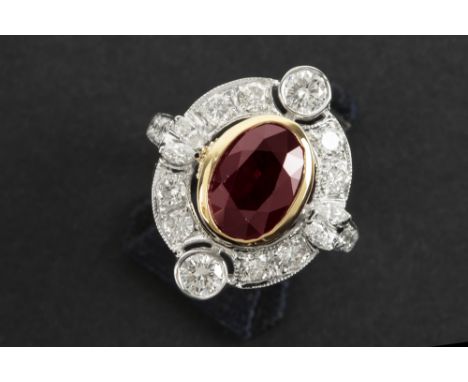 important ring with a classy design in white gold (18 carat) and with a central, oval 3,72 carat Siamese ruby with superb dee