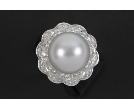 ring in white gold (18 carat) with a quite big South Sea pearl surrounded by ca 0,50 carat of high quality brilliant cut diam