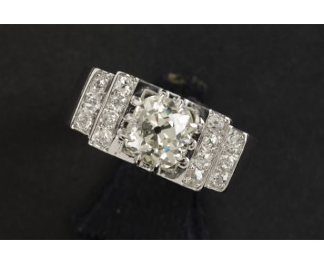 Art Deco ring in platinum with a 2,16 carat quality old brilliant cut diamond and ca 0,35 carat of small quality old brillian