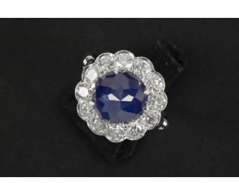 fifties' vintage ring in platinum with a ca 5,50 carat Ceylan sapphire (with a special pyramidal shape), surrounded by ca 1,4
