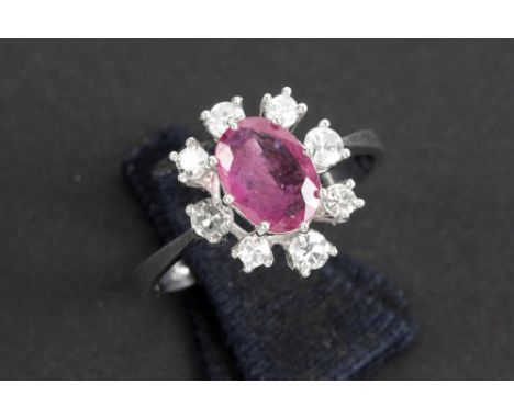 ring in white gold (18 carat) with a ca 1 carat ruby surrounded by at least 0,30 carat of high quality brilliant cut diamonds