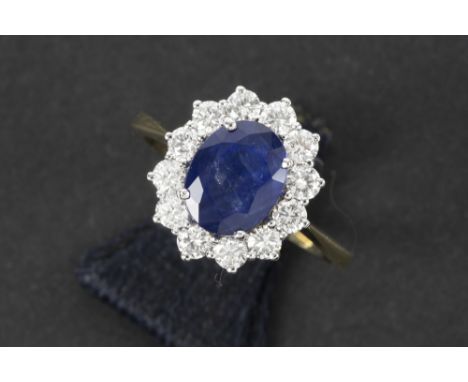 ring in yellow and white gold (18 carat) with a ca 1,80 carat Siamese sapphire and ca 0,90 carat of high quality brilliant cu