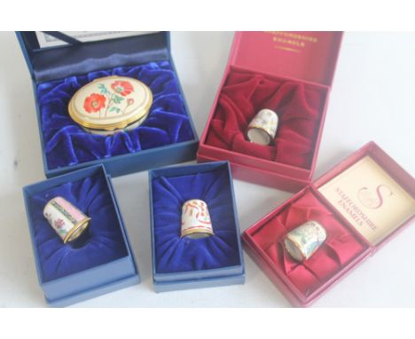 A BOXED HALCYON DAYS "BRITISH MUSEUM BOX", two Halcyon Days Enamels thimbles and two Staffordshire Enamel thimbles