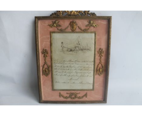 AN EDWARDIAN GILT METAL EASEL PHOTOGRAPH FRAME, with pink silk insert and decorated with cherubs, birds, and swags
