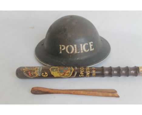A VINTAGE POLICEMAN'S HELMET, MARKED 'POLICE', together with a Wooden Truncheon from the Borough of Walsall marked 'Special C