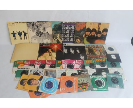 A QUANTITY OF RECORDS AND SINGLES, to include the Beatles, Rolling Stones, Elvis, collection of Beatles photos etc