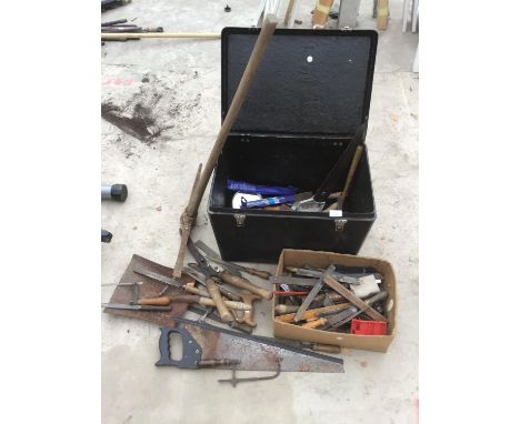 A TOOL BOX CONTAINING VARIOUS TOOLS TO INCLUDE A PICKAXE, SAWS, SHEARS, RASPS ETC 