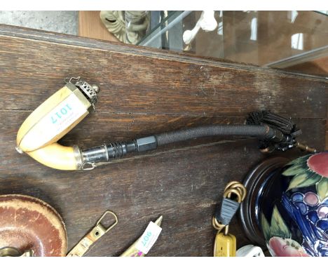 AN OPIUM PIPE 