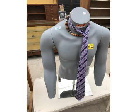 A MALE TORSO MANNEQUIN 