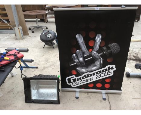 A LARGE OUTDOOR LIGHT AND A PULL OUT SIGN 