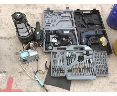 A BOXED PERFORMANCE HAMMER DRILL, A BOXED CORDLESS DRILL (NO CHARGER), A BOX OF VARIOUS DRILL BITS AND ATTACHMENTS, A LANTERN