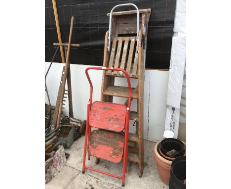 TWO VINTAGE WOODEN FOUR STEP LADDERS AND A METAL TWO STEP LADDER 