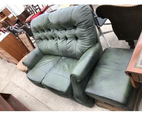 A GREEN LEATHER CHESTERFIELD STYLE BUTTON BACK TWO SEATER SOFA WITH FOOTSTOOL 