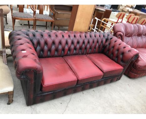 AN OX BLOOD LEATHER THREE SEATER CHESTERFIELD SOFA 