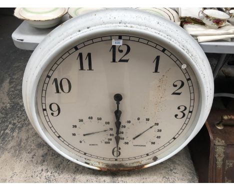 A LARGE ROUND WHITE METAL WALL CLOCK WITH TEMPERATURE GAUGE 