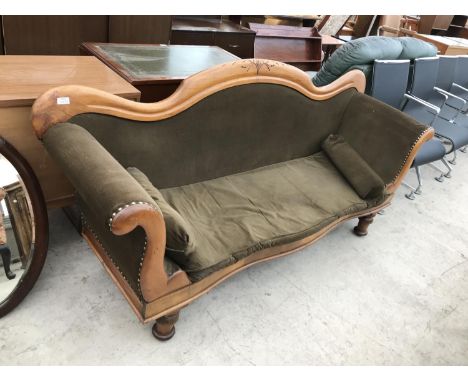 A MAHOGANY TWO SEATER SOFA WITH ROLL TOP ARMRESTS 