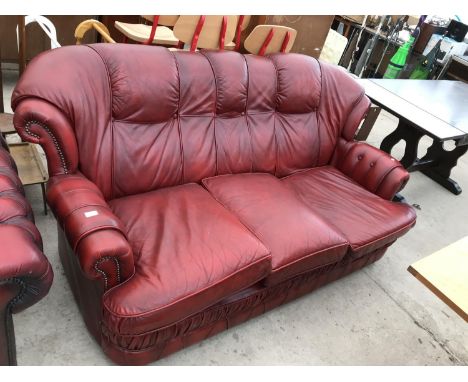 AN OX BLOOD LEATHER THREE SEATER SOFA 