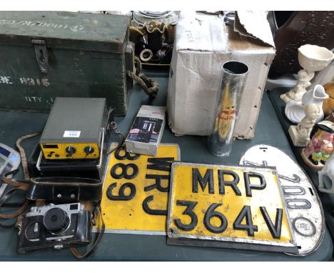 A MIXED GROUP OF ITEMS - RED BULL STANDS, NUMBER PLATES, CAMERA ETC 