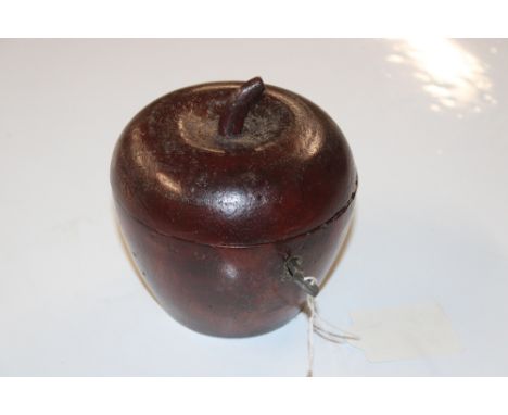 A wooden tea caddy in the form of an apple 