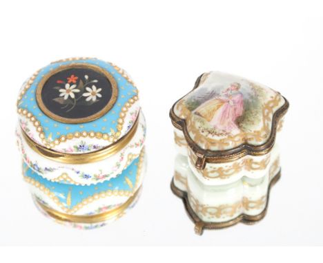 A Sevres porcelain patch box with hinged lid and gilded interior decorated figure of a seated maiden in flowing dress and pin