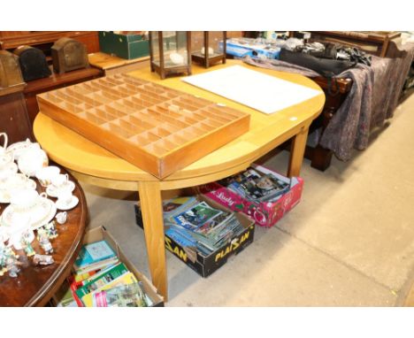 A modern light wood extending dining table