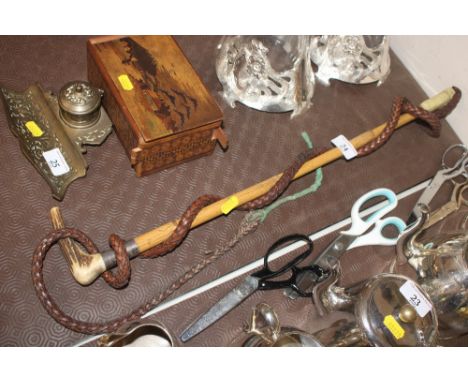 A vintage bamboo hunting whip with horn handle