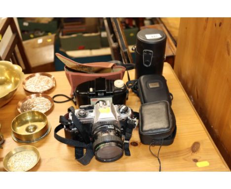 A Nikon camera; and a vintage Kodak camera, lens and accessories 