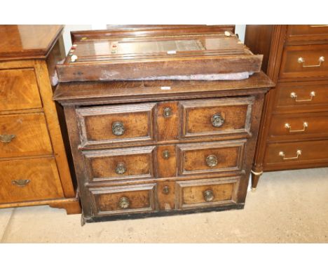An 18th Century  oak chest of three geometric moulded panel drawers in need of restoration