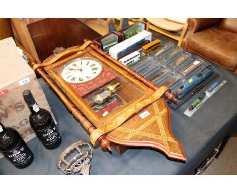A Victorian walnut and inlaid wall clock by K Worcester